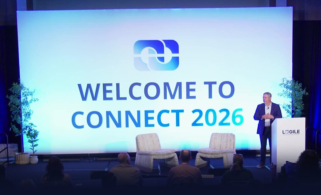 The Connect 2026 main stage, with Welcome to Connect 2026 on the screen and attendees in the audience